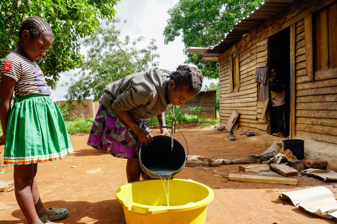 Ruvarashe Murangariri, 16, washes dishes at her home. Murangariri had hoped education would change her life, but after losing donor-funded school support, she faces an uncertain future.